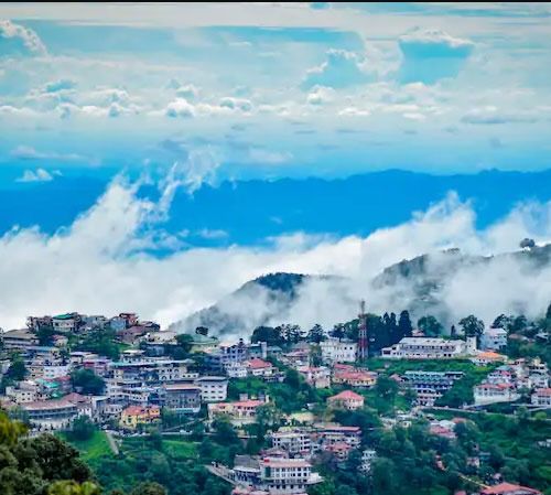 Mussoorie, a picturesque hill station in Uttarakhand, known for its stunning views, colonial architecture, and lush greenery along the Himalayas.