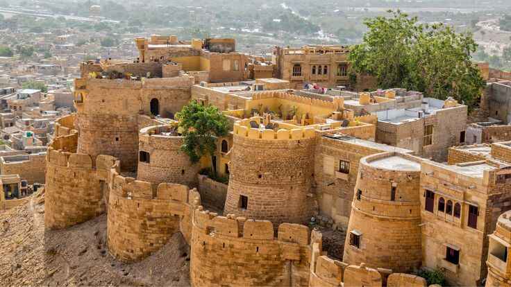 Jaisalmer, a unique gem among places to visit in Rajasthan, features stunning golden fort architecture, desert landscapes, and vibrant cultural experiences.